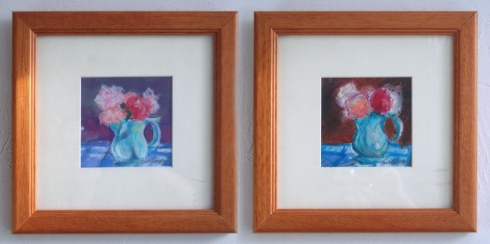two framed pastel paintings of pink geraniums