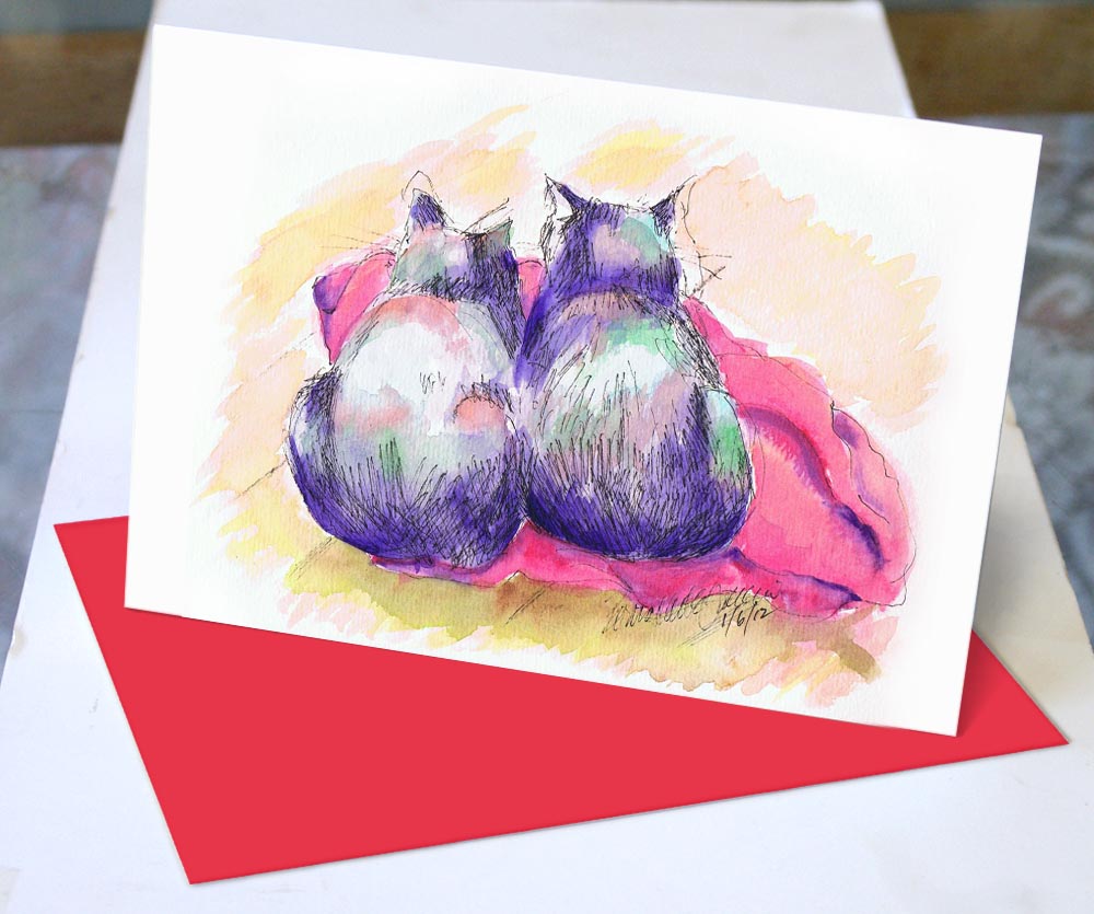 note cards with purple cats and red blanket