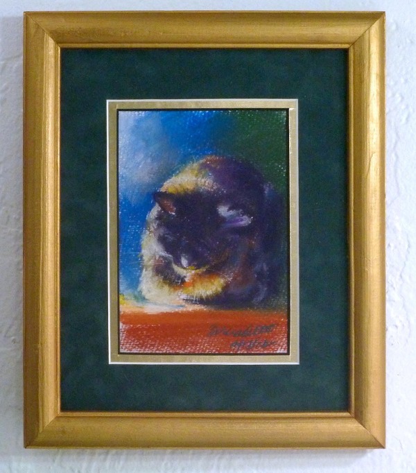 framed painting of sleeping cat